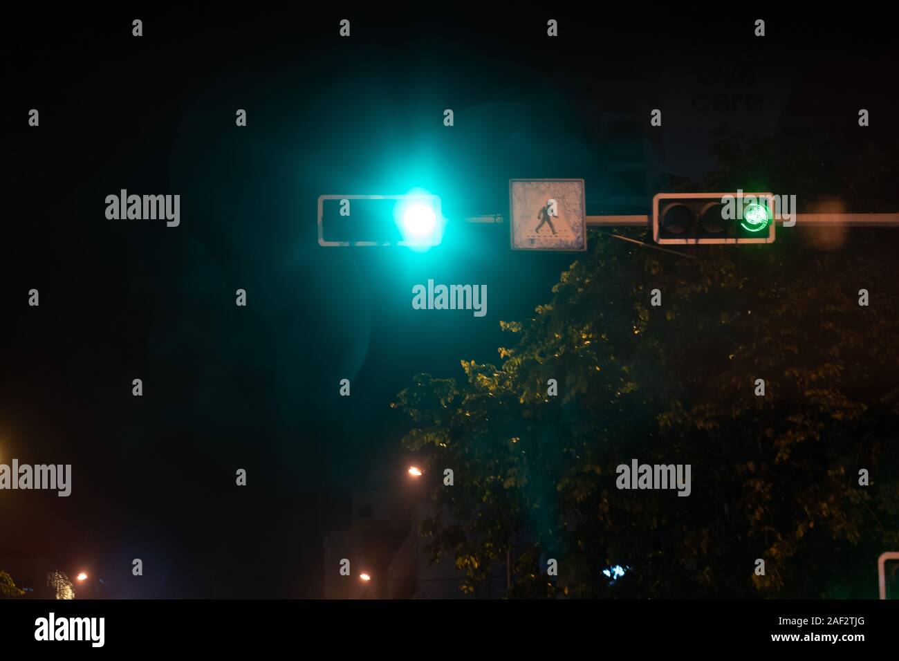 traffic lights, car lights at night on the road going to the city Stock