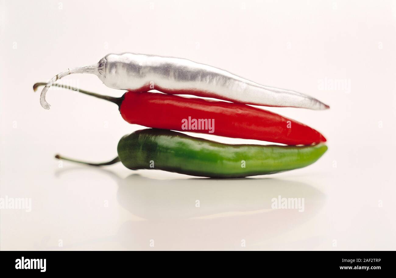 Still life. Food. Foil wrapped, red and green peppers. Stock Photo