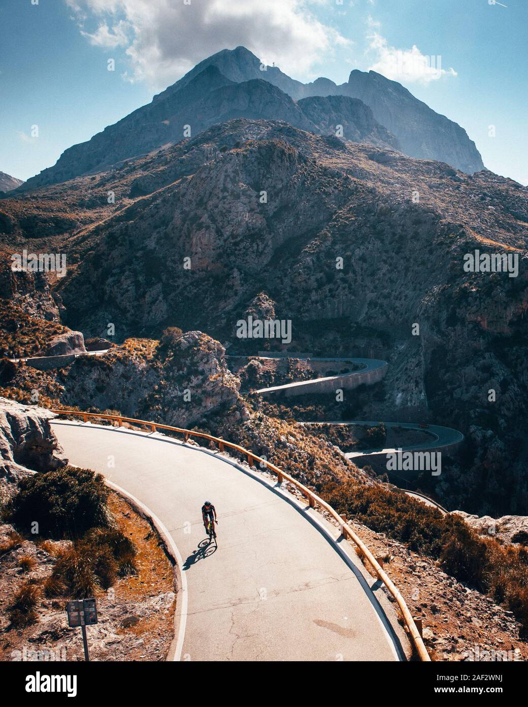 Man ride on bicycle in Famous Sa Calobra Climb in Mallorca Original sport wallpaper Stock Photo