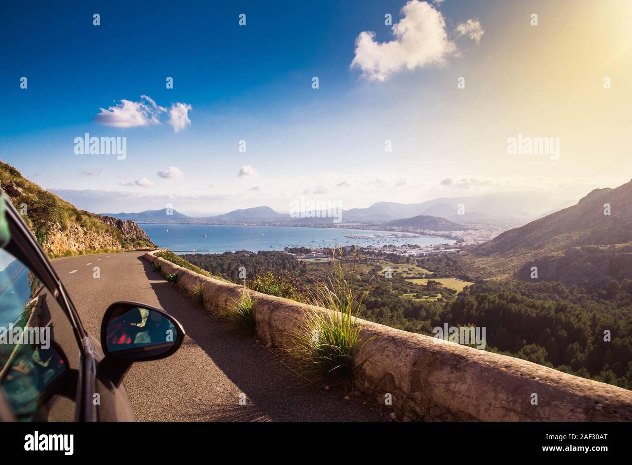 View from car at beautiful summer vacation landscape. Port, sea, mountains. Traveling photo Stock Photo