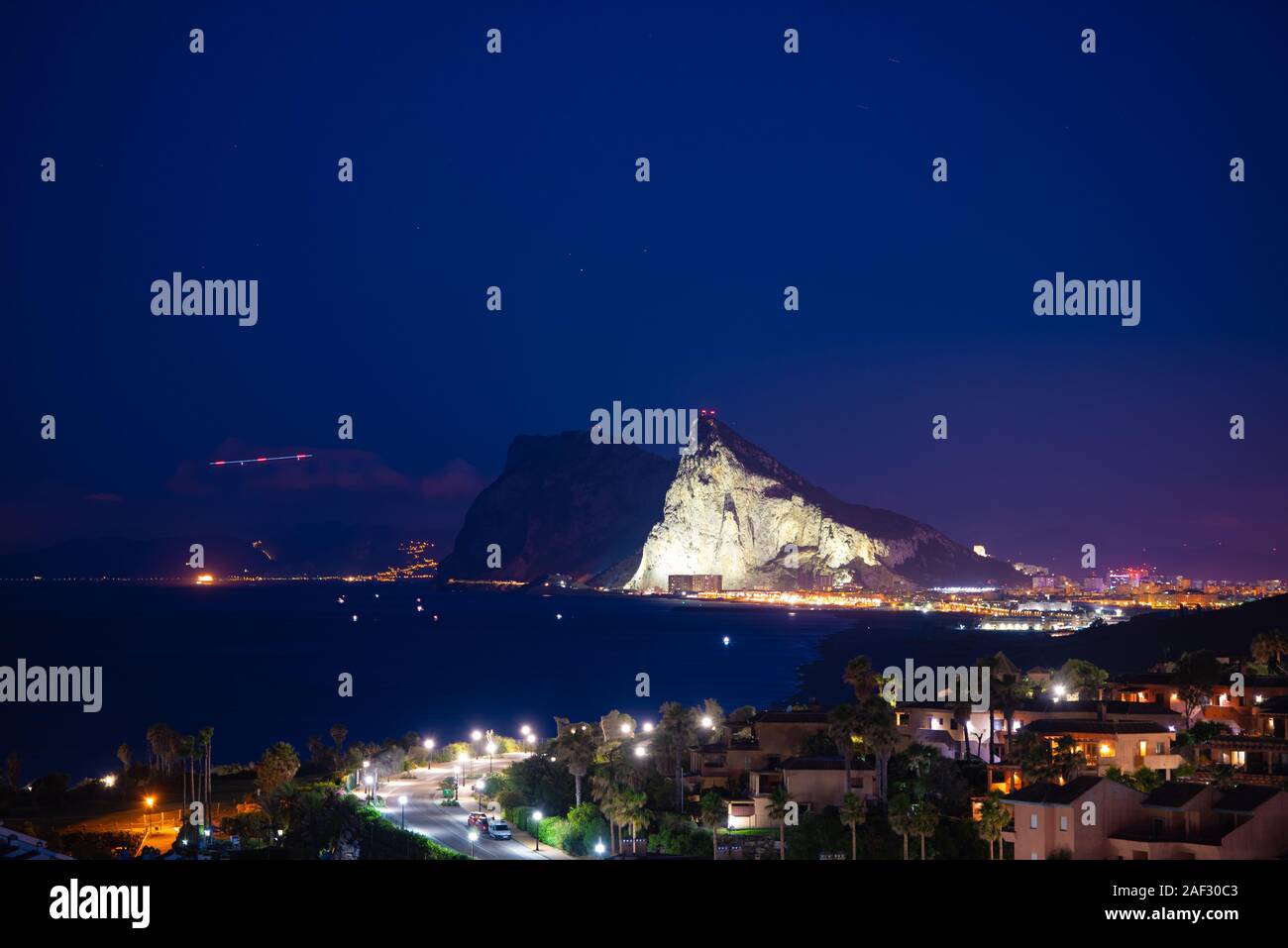 A view of Gibraltar at night from Alcaidesa Stock Photo