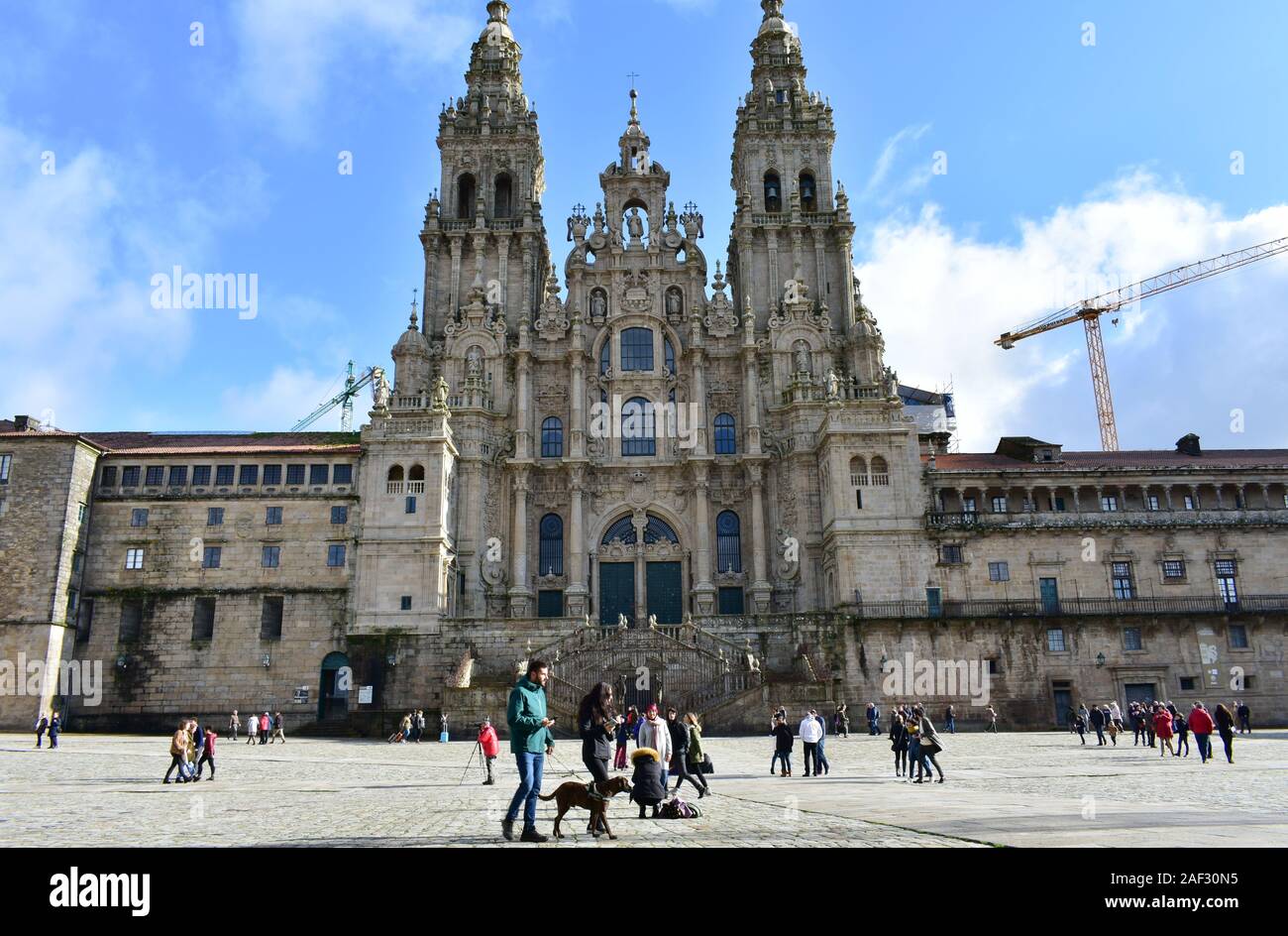 Pilgrims taking pictures in front of Cathedral at Praza do Obradoiro. Santiago de Compostela, Spain. Dec 1, 2019. Stock Photo