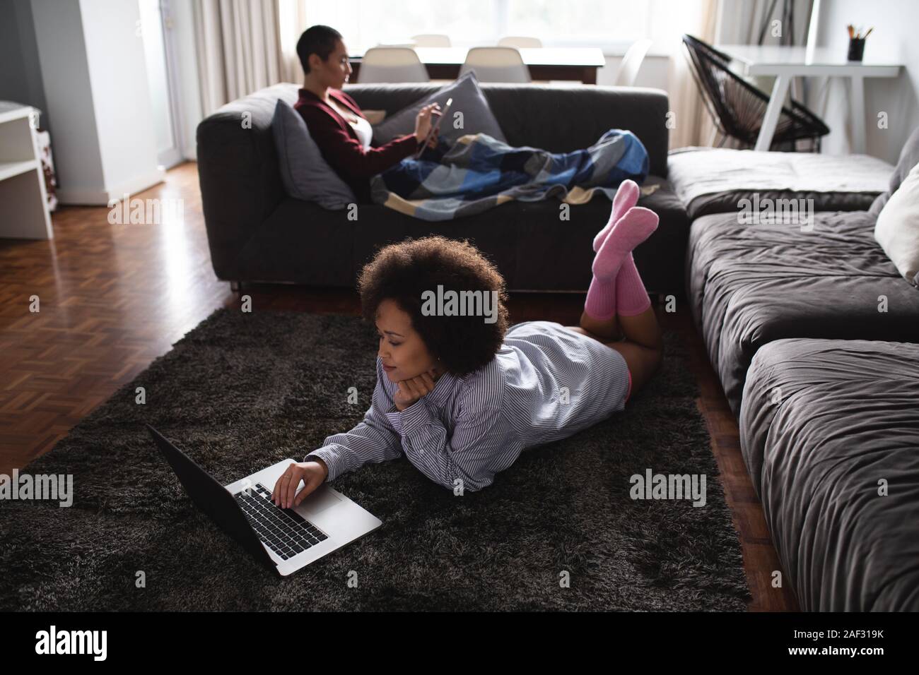 Female couple relaxing at home Stock Photo