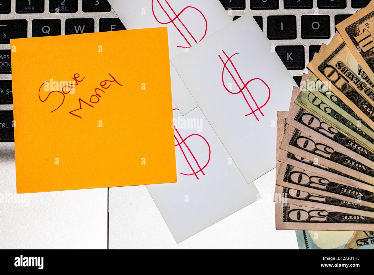 Writing on colorful sticky note Save money. Sticky note, post it, white