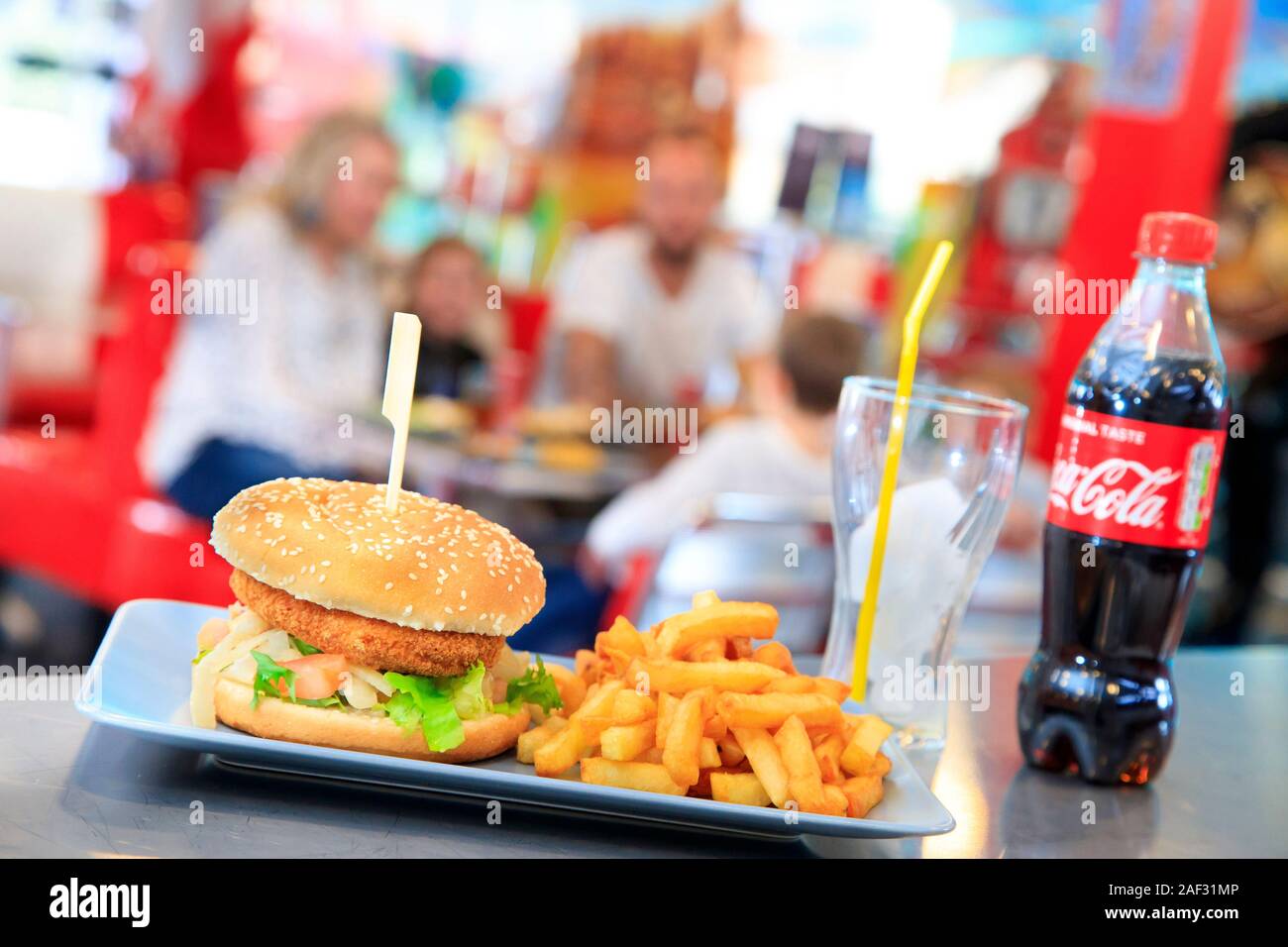 Fast food. Hamburger with fish, French fries and a Coke Stock Photo