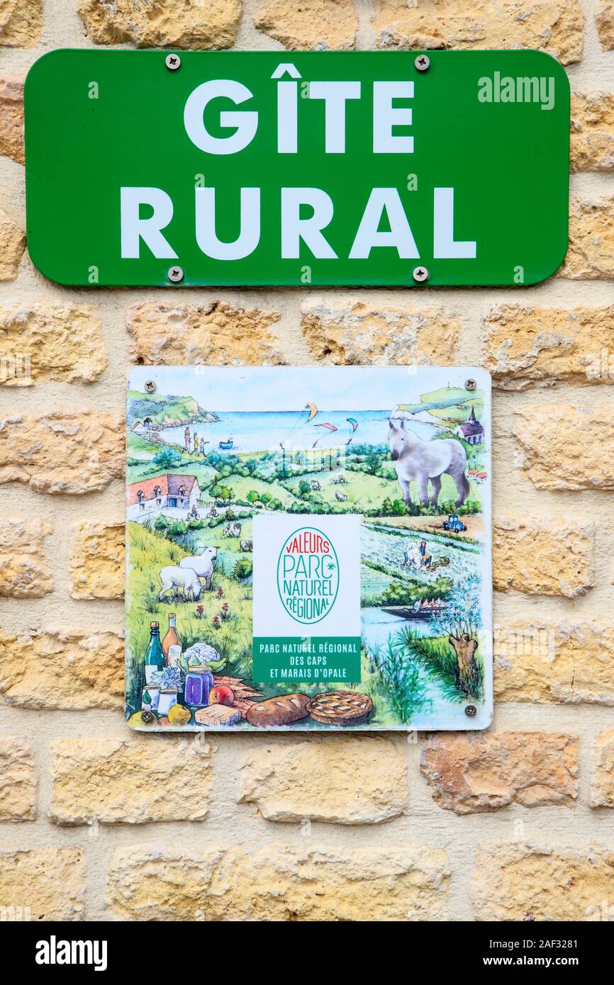 Sign 'cottage' (vacation rental) and sign with brand 'Valeurs Parc naturel regional. Caps et Marais d'Opale Regional Nature Park (regional nature par Stock Photo