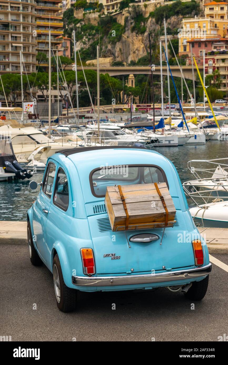 Monaco 5 DEC 2019 Old and vintage blue Fiat 500 car with wooden box on its  back in port of Monaco city and in the cityscape and yachts background  Stock Photo - Alamy