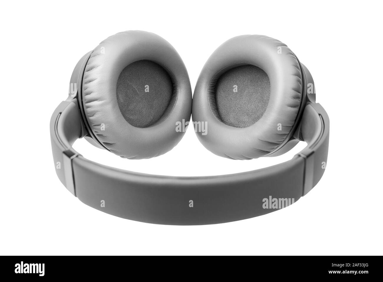 Gray wireless headphones on white background isolated close up, big grey bluetooth headset design, modern black wi-fi stereo sound earphones side view Stock Photo