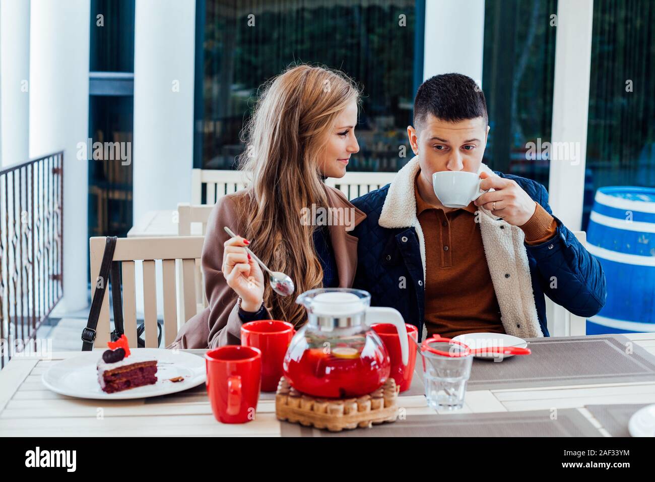 restaurant. a guy with a girl drink hot coffee and tea Stock Photo Alamy