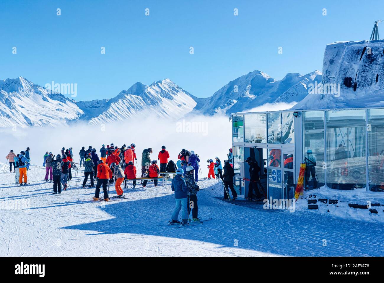 Zillertal Arena ski resort clouds people skiing Mayrhofen in Austria Stock Photo