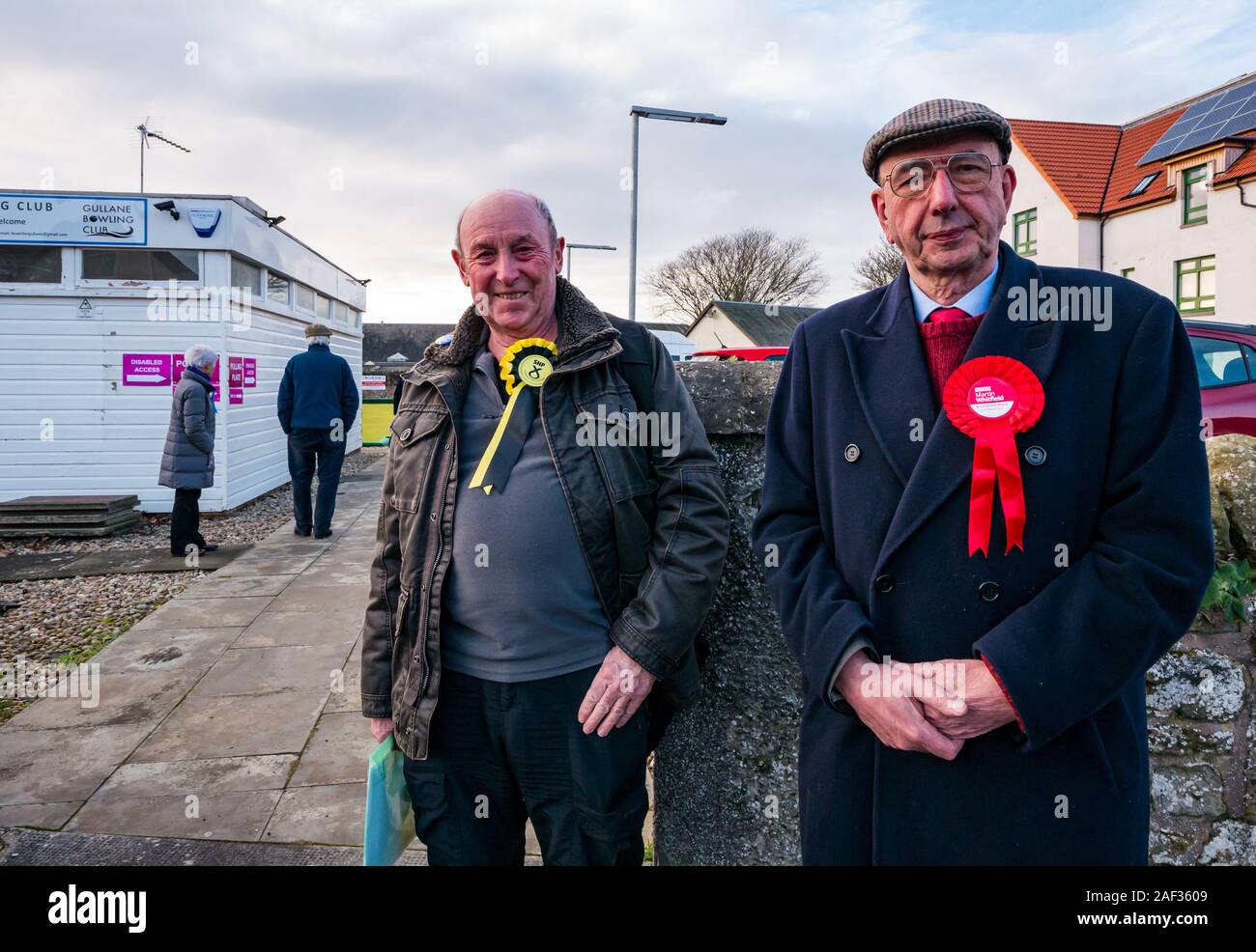 Gullane Bowling Club, East Lothian, Scotland, United Kingdom, 12th December 2019. UK election: John Beard, local SNP convener and Scottish Labour Party councillor Jim Goodfellow at the local polling place. Stock Photo