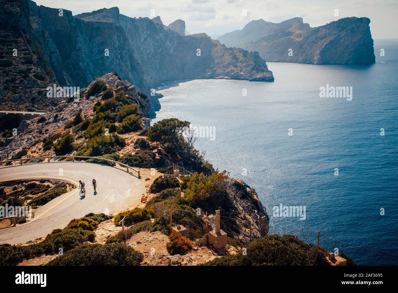 couple of cyclist on the road in Cap de Formentor. Mallorca, Spain Stock Photo