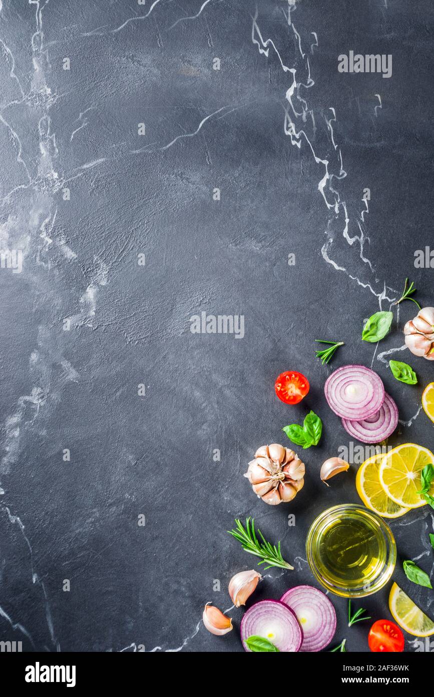 Cooking background with spices, vegetables and herbs fresh basil ...