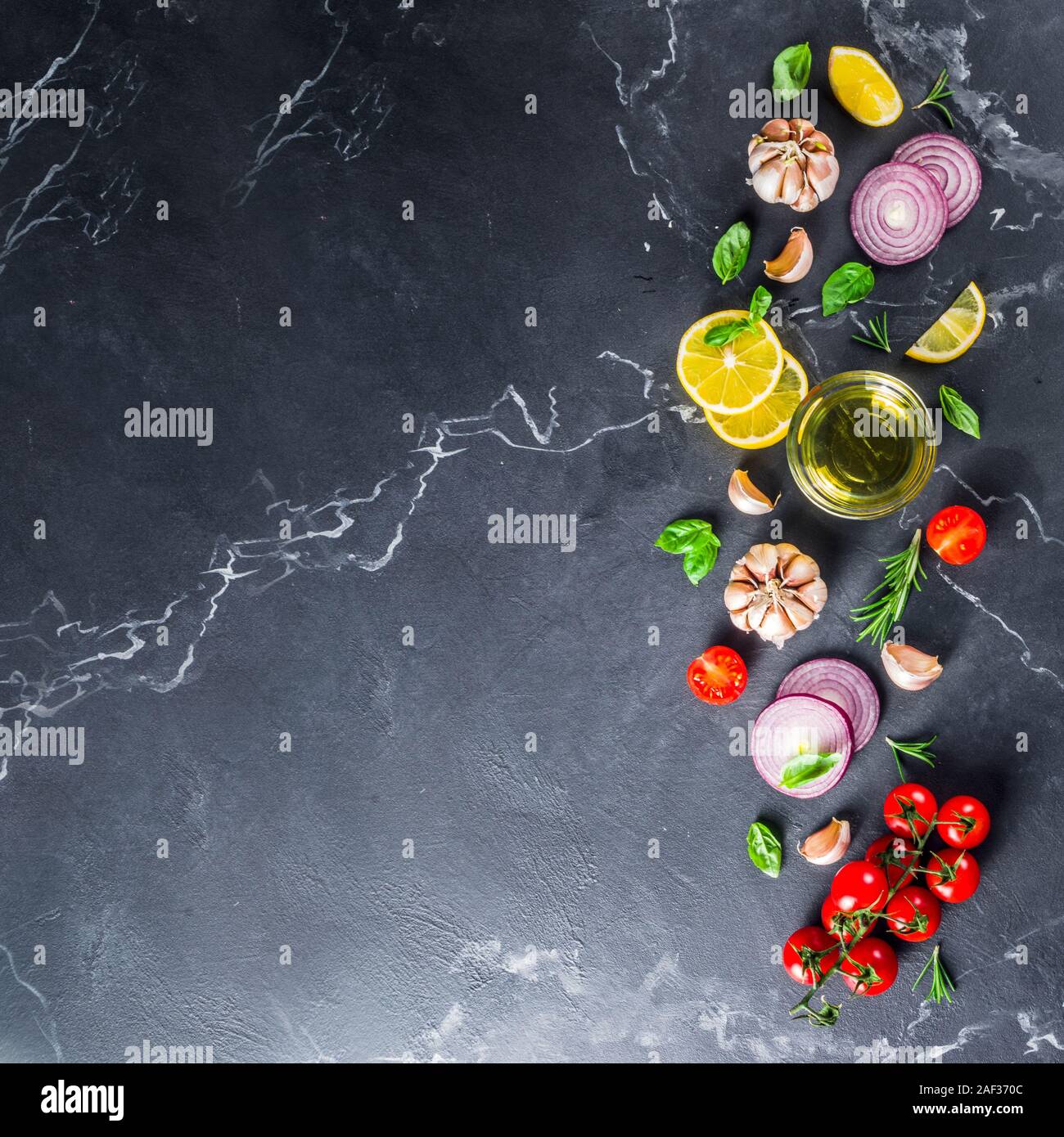 Cooking background with spices, vegetables and herbs fresh basil ...