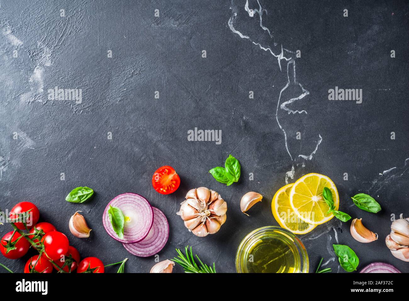 Cooking background with spices, vegetables and herbs fresh basil ...