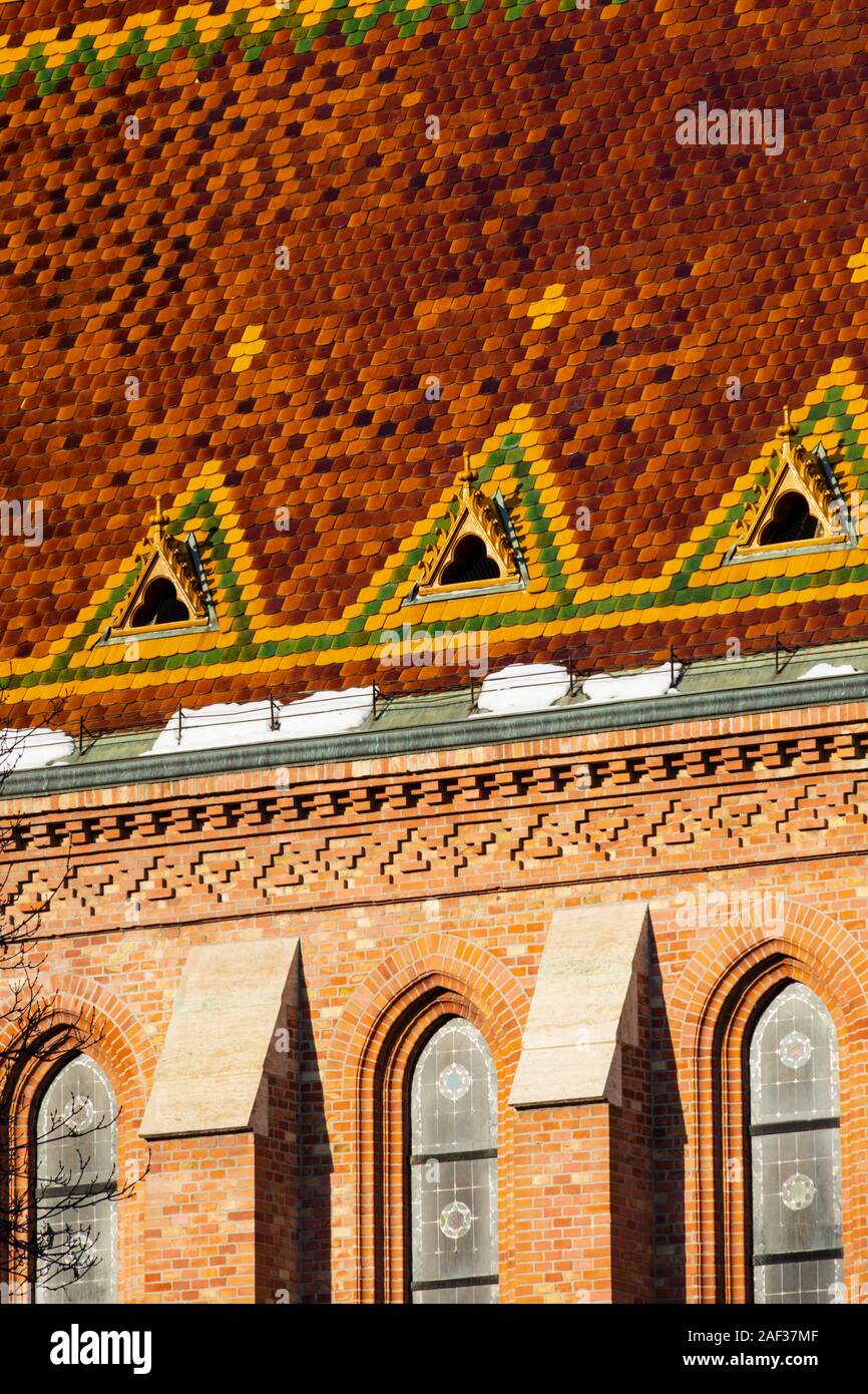 Colourful glazed tiles on the roof of the Szilagyi Dezso Square Reform Church, Winter in Budapest, Hungary. December 2019 Stock Photo