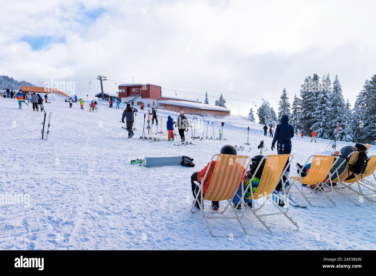 People relaxing and sitting on deck chairs in Zillertal Arena Stock Photo
