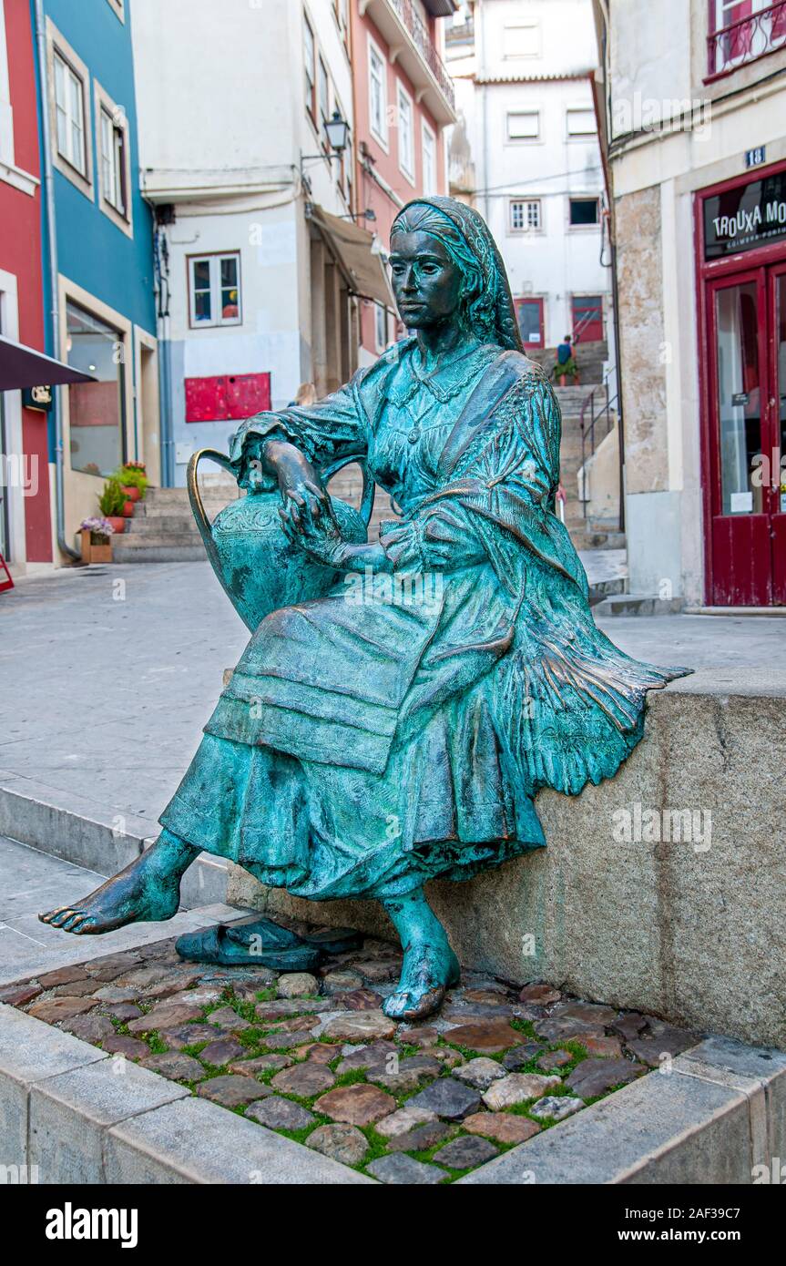 Statue of traditional Portuguese woman in the historical center near the Arco de Almedina. Coimbra, Portugal Stock Photo