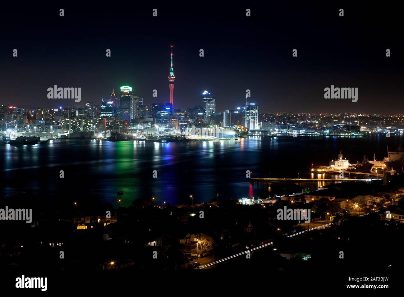 Downtown Auckland city viewed across Waitemata Harbour from Mount Victoria, Devonport at night. New Zealand Stock Photo