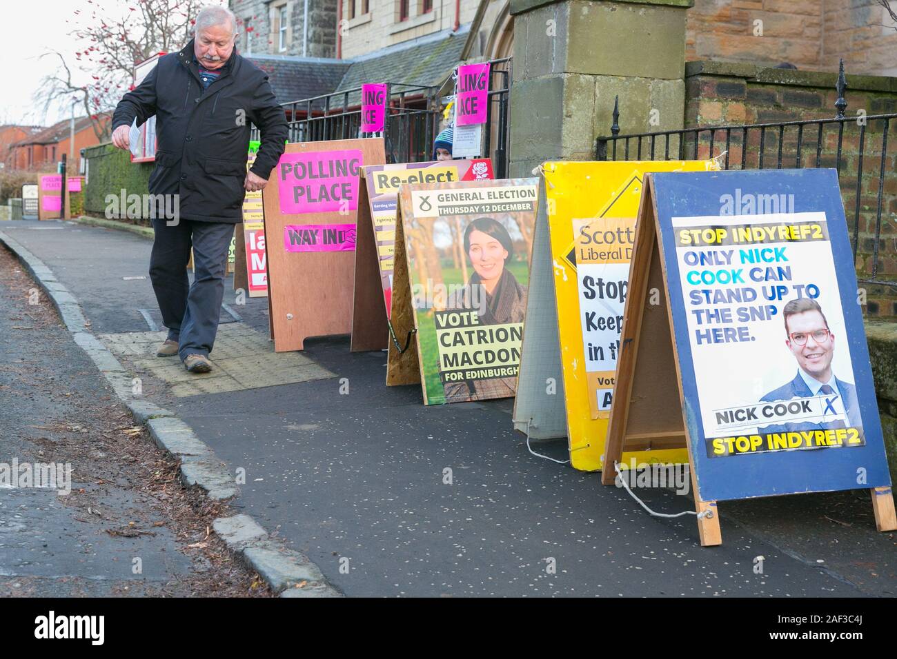 Edinburgh, Scotland, 12th December 2019. A committed voter at the UK's winter General Election exits the Polling Station after casting his vote. Credit: Brian Wilson/Alamy Live News. Stock Photo
