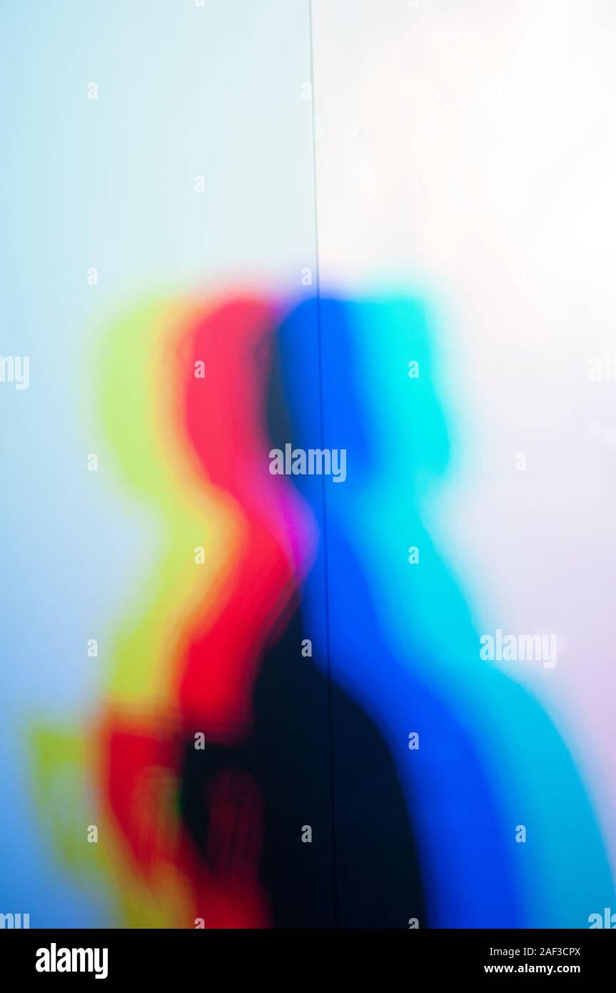 Art project. Color lights are projected onto a reflective screen the