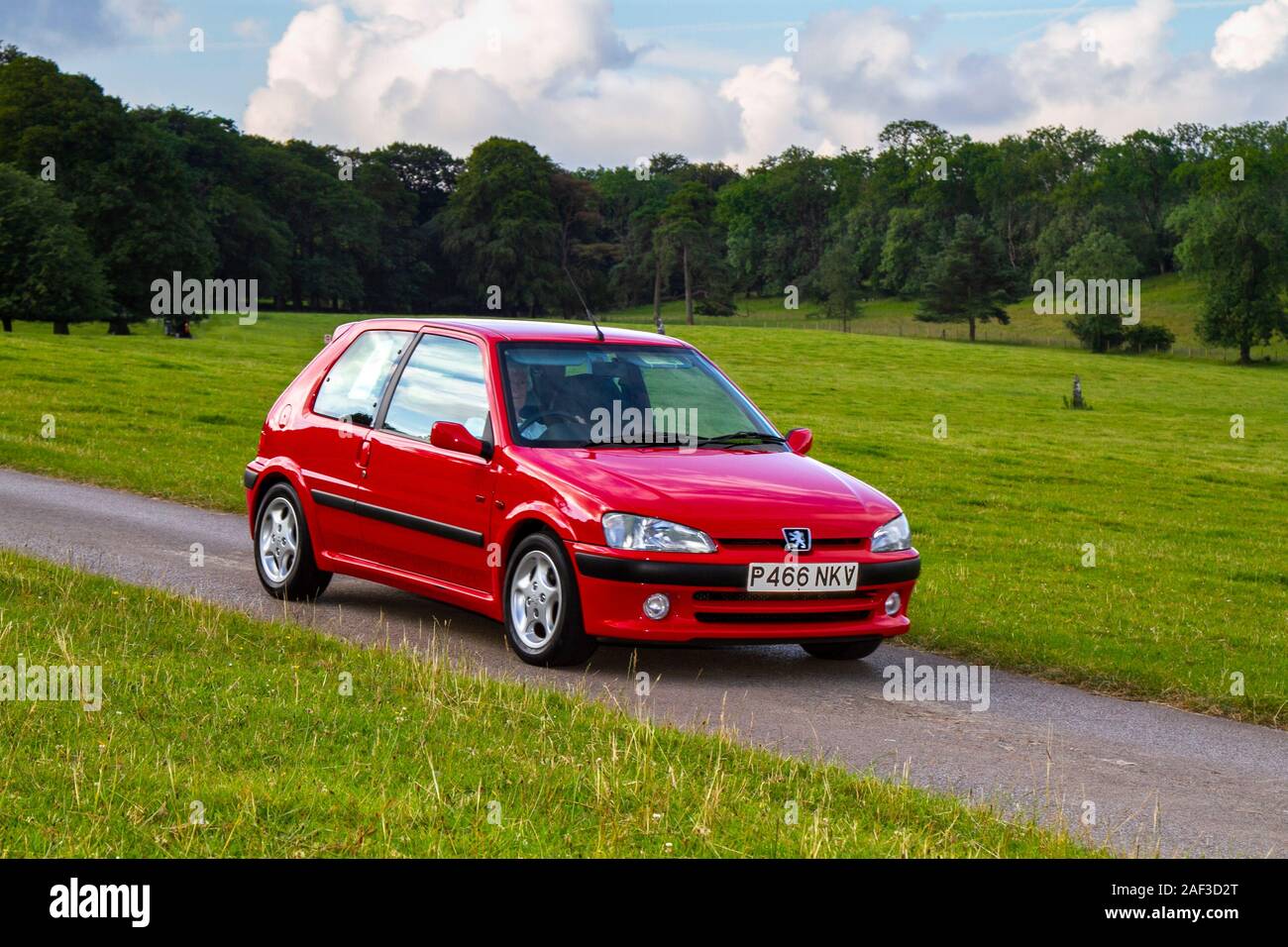1997 90s petrol hatchback red Peugeot 106 GT; Classic cars, historics,  cherished, old timers, collectable restored vintage veteran, vehicles of  yesteryear arriving for the Mark Woodward historical motoring event at  Leighton Hall,