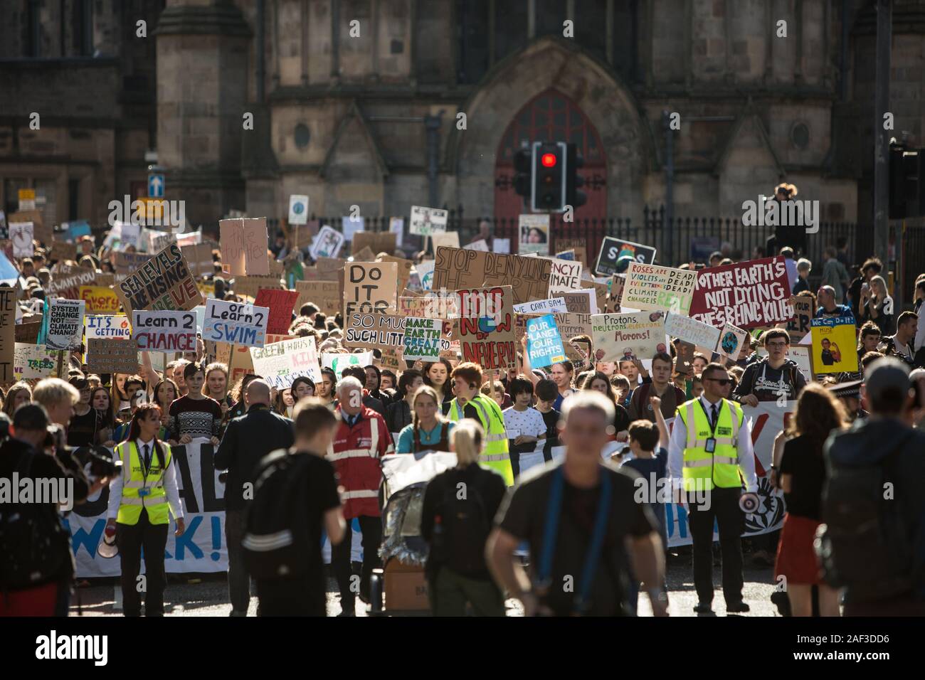 Scottish youths strike for the climate, during a global day of action, taking the day off school and educational establishments to protest the Government's inaction on the climate crisis, in Edinburgh, Scotland, 20th September 2019. The youths made their way from the Meadows area of the city, down the historic Royal Mile to the Scottish Parliament. Stock Photo