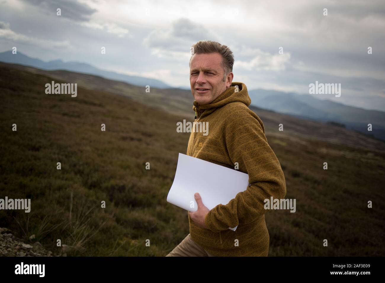 TV presenter Chris Packham,  with film crew on the Strathbraan raven cull area, in Amulree, Scotland, on 7 June 2019. Stock Photo