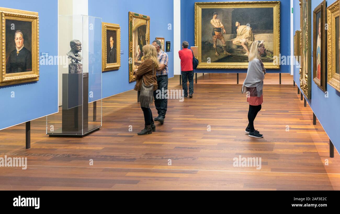 Visitors viewing exhibits in the Malaga Museum in the Palacio de la Aduana, Malaga, Costa del Sol, Malaga Province, Andalusia, southern Spain. Stock Photo