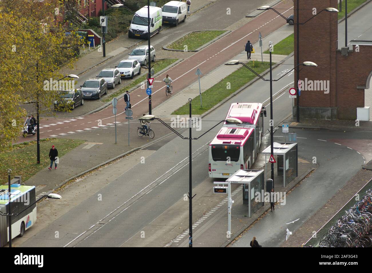 Nijmegen, Netherlands - November 22, 2019: Bus on the road for transport people at Nijmegen station seen from above Stock Photo