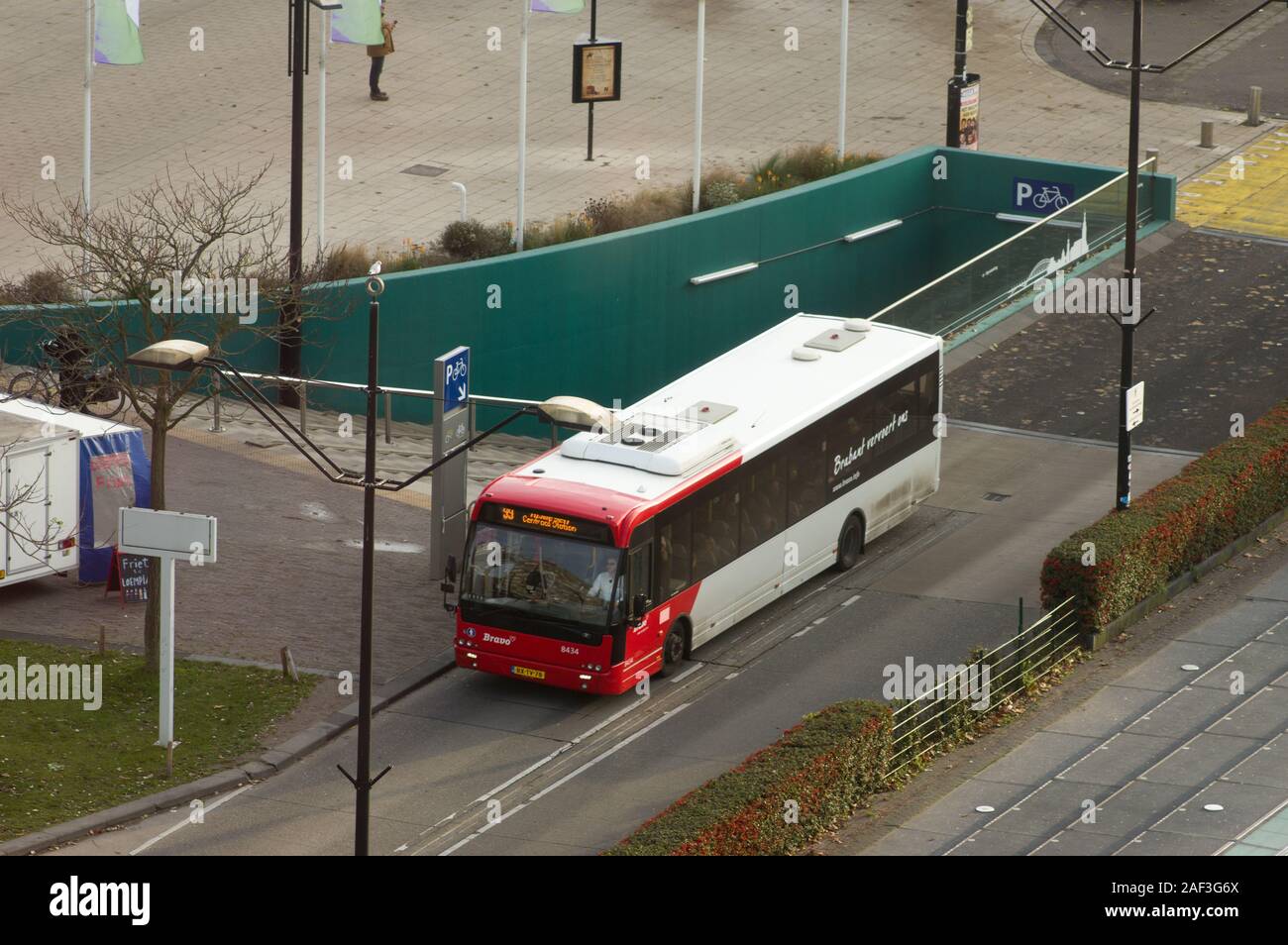 Nijmegen, Netherlands - November 22, 2019: Bus on the road for transport people at Nijmegen station seen from above Stock Photo