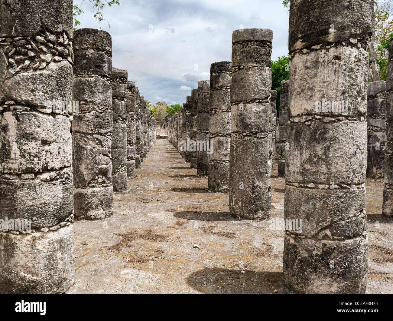Thousand columns structure - Mayan ruins featuring carved pillars at Chichen Itza archaeological site. Stock Photo