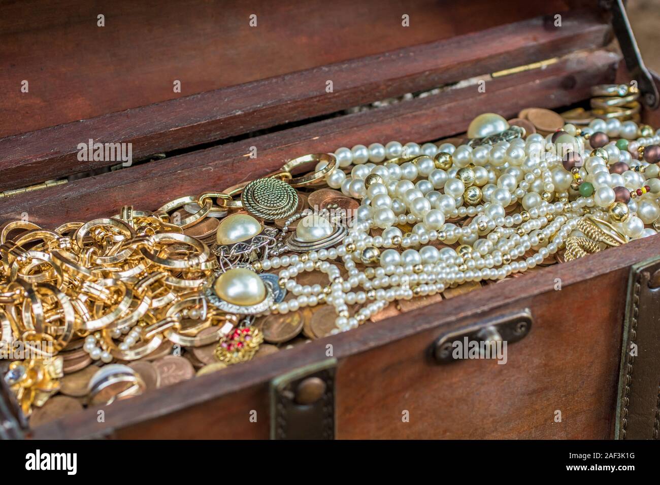 Old treasure chest with precious treasure Stock Photo