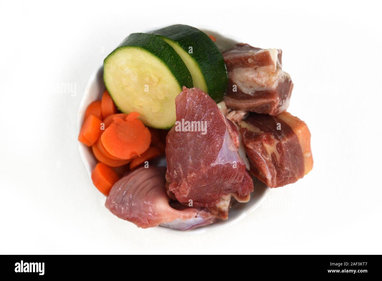 Top view of dog bowl filled with mixture of biologically appropriate