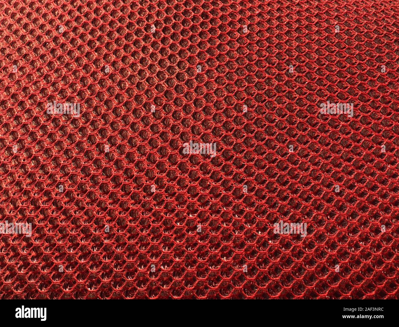 Synthetic fabric texture, red cell, nice background pattern. For upholstery of furniture. Stock Photo