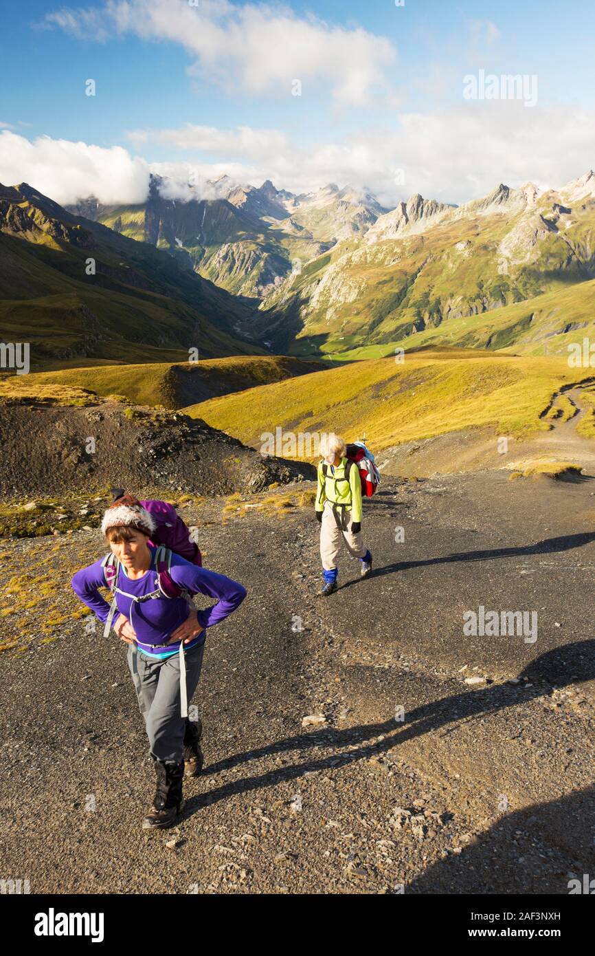 Walkers on the Tour de Mont Blanc ascending the Col de la Seigne Stock Photo