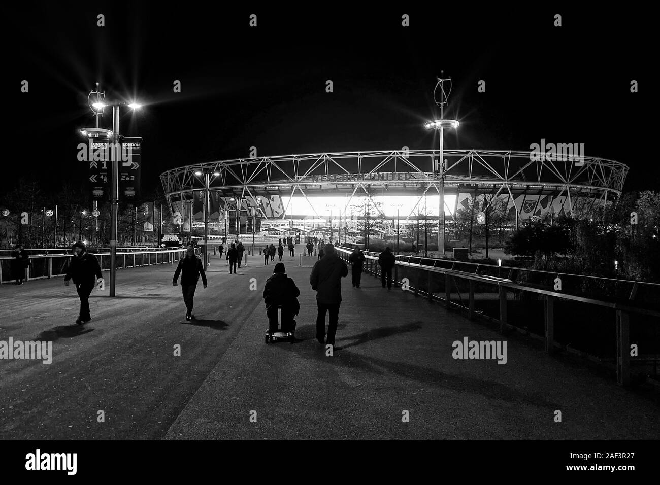 Fans make their way to the London Stadium - West Ham United v Arsenal, Premier League, London Stadium, London, UK - 9th December 2019  Editorial Use Only - DataCo restrictions apply Stock Photo