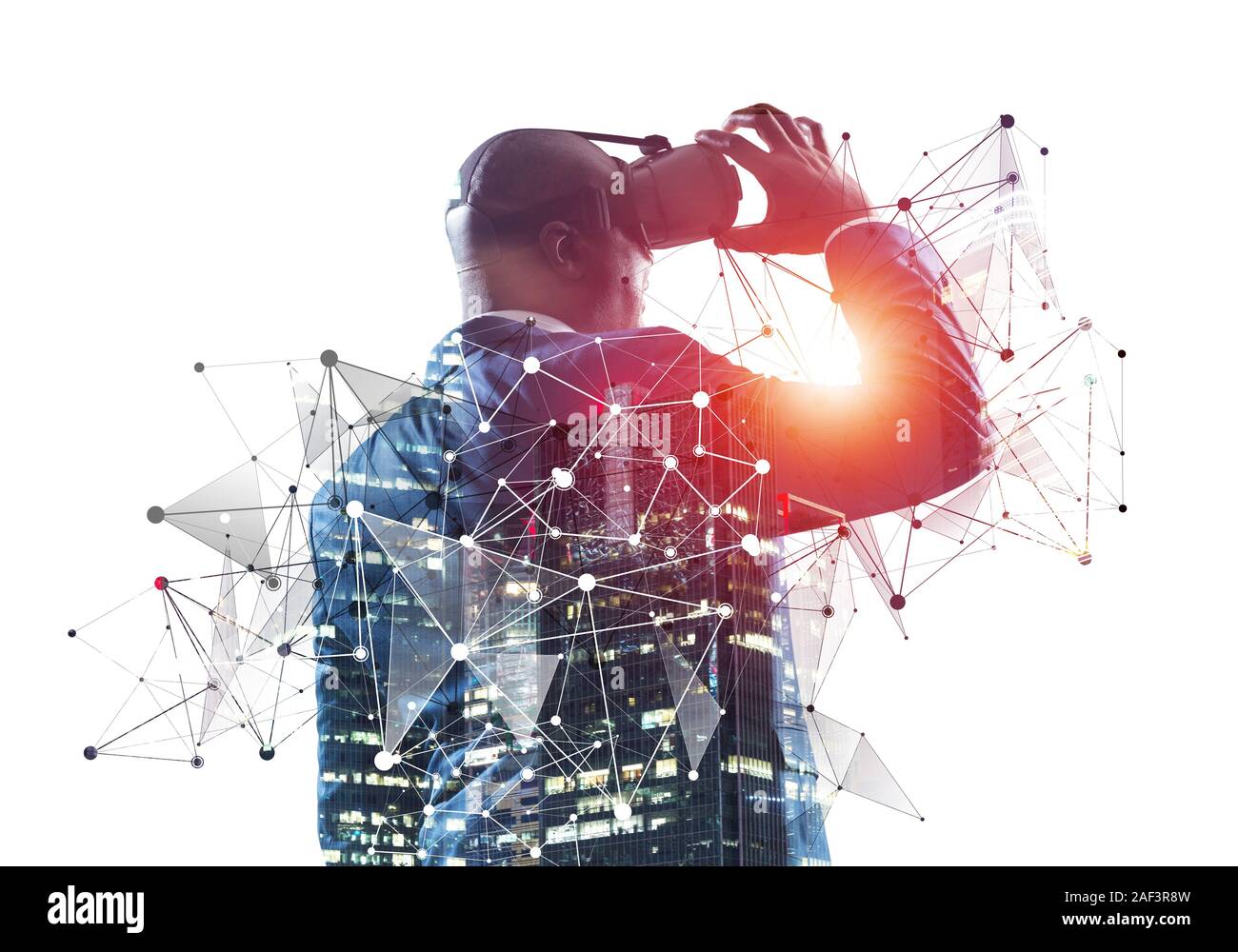 African businessman wearing VR goggles and exploring virtual reality ...
