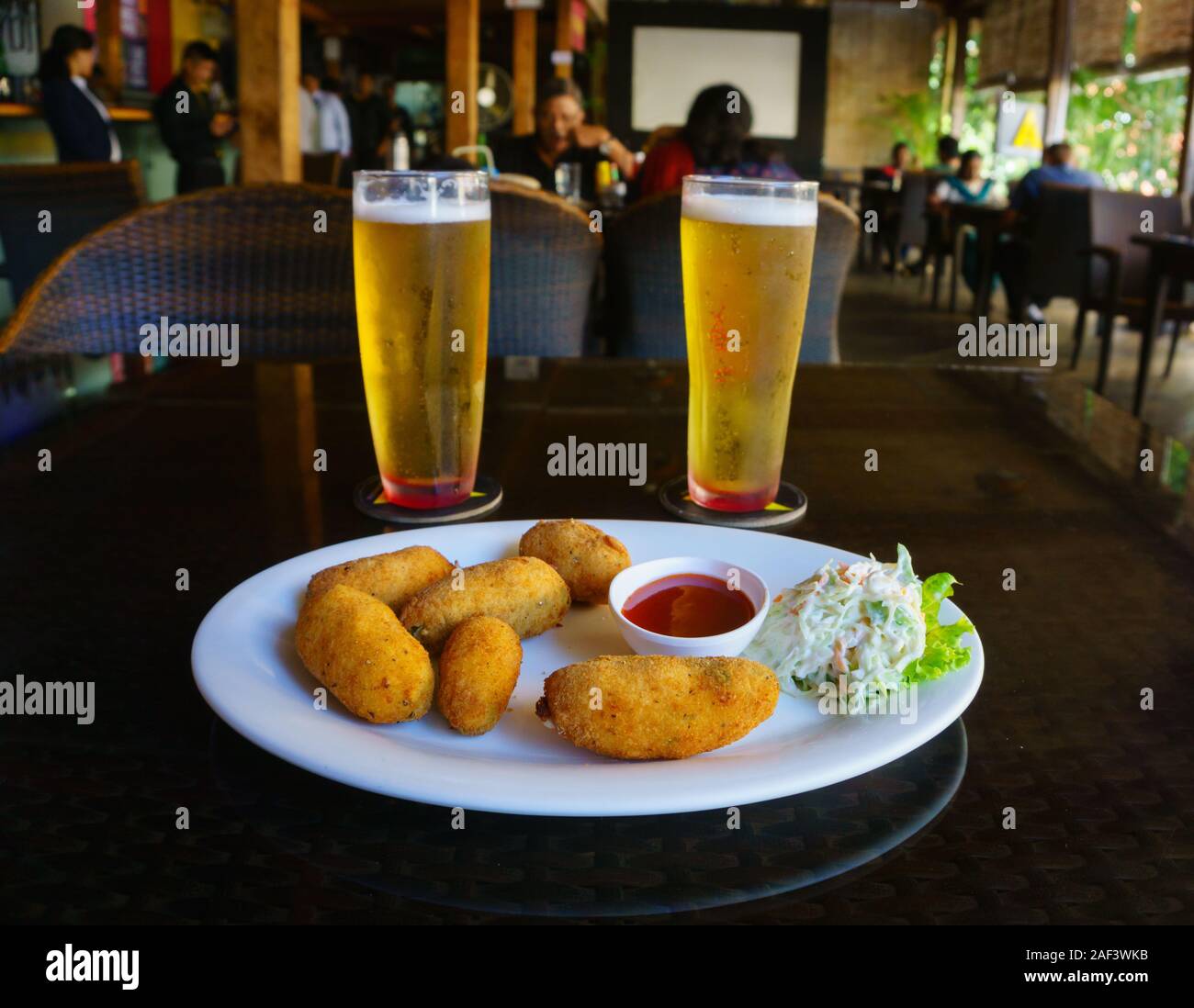 Chilled beer and fried cheese balls served in a restaurant locate in Church Street, Bangalore