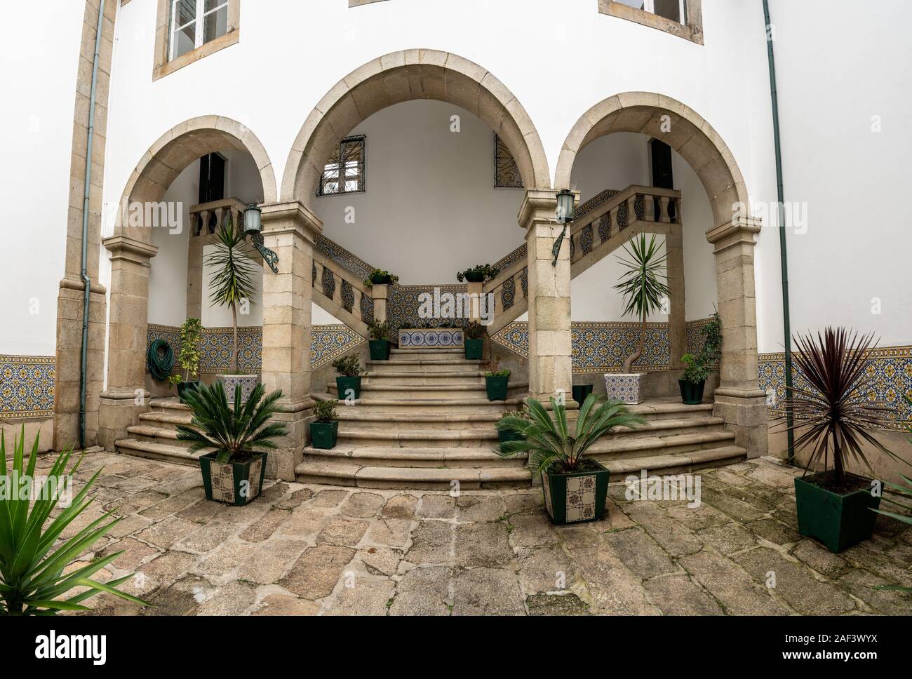 Guimaraes, Portugal - 18 August 2019: Interior courtyard of the Nossa Senhora do Carmo church with steps Stock Photo