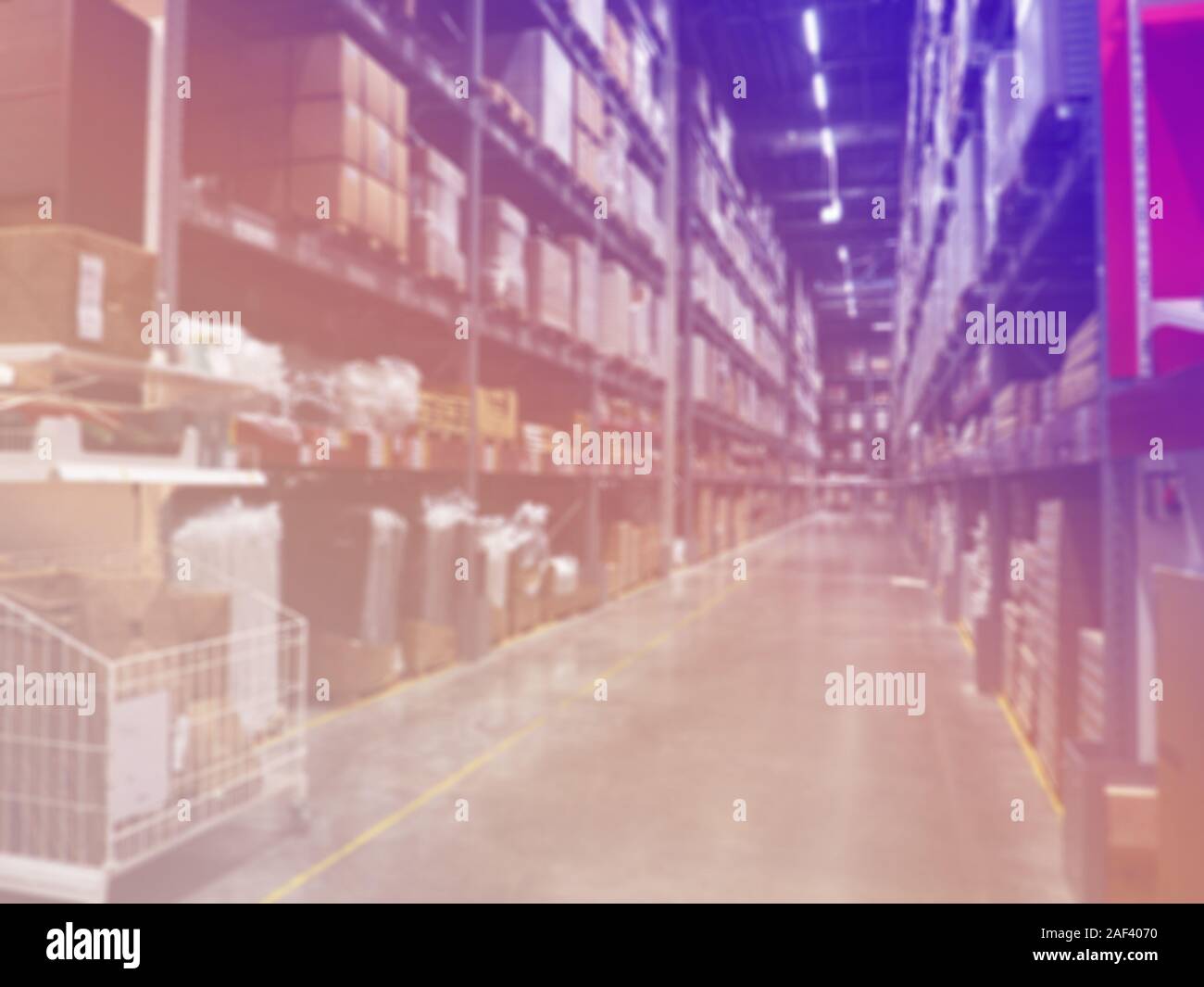 Shelf Storage in hypermarket interior blur background. warehouse with shelves blurred with illumination, logistics, background Stock Photo