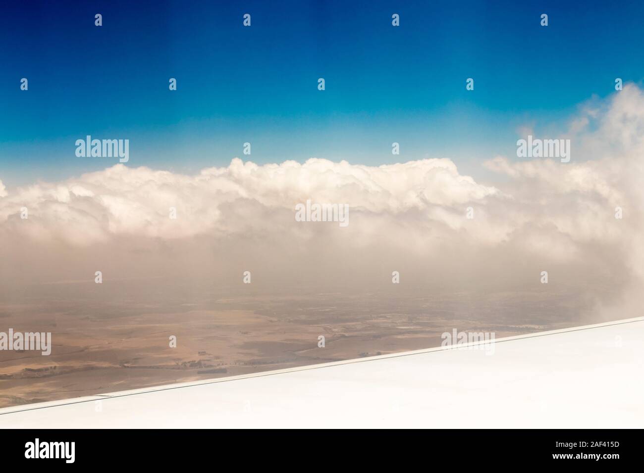 View from an airplane window at high altitude and turbines about Africa. Stock Photo