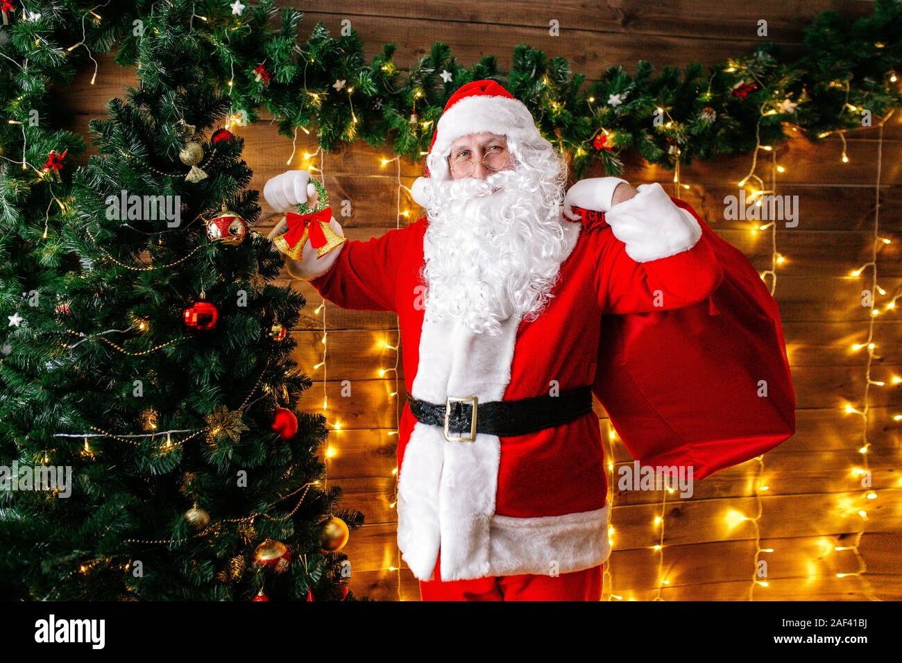Santa Claus bring the sack with gifts for Christmas. Stock Photo