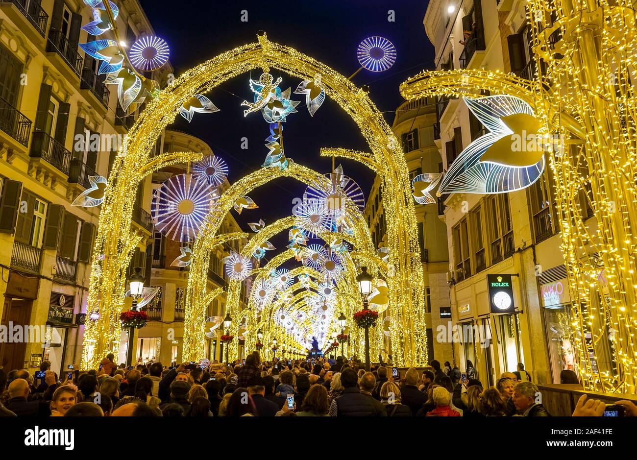 December 2019, Christmas lights illuminated arches, Calle Larios, Malaga city, Spain Stock Photo Alamy