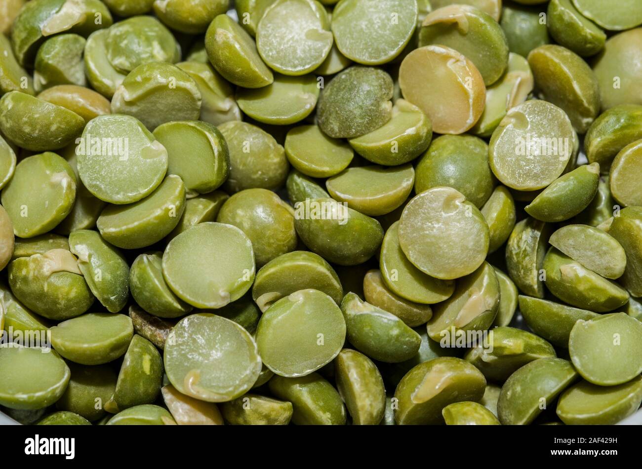 Background with peas in the foreground Stock Photo