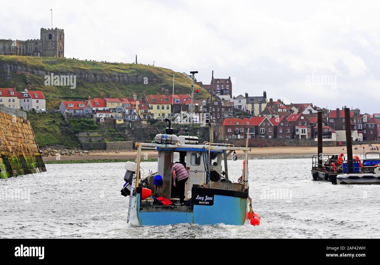 Coming up the river Esk into Whitby harbour. Stock Photo