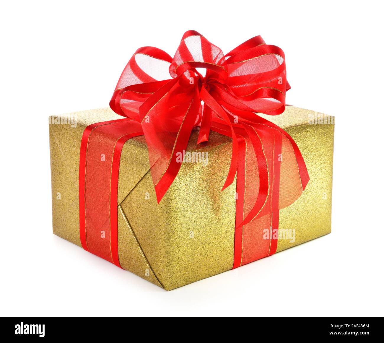 Gold gift box with red ribbon and a nice fancy bow, studio isolated on white background Stock Photo