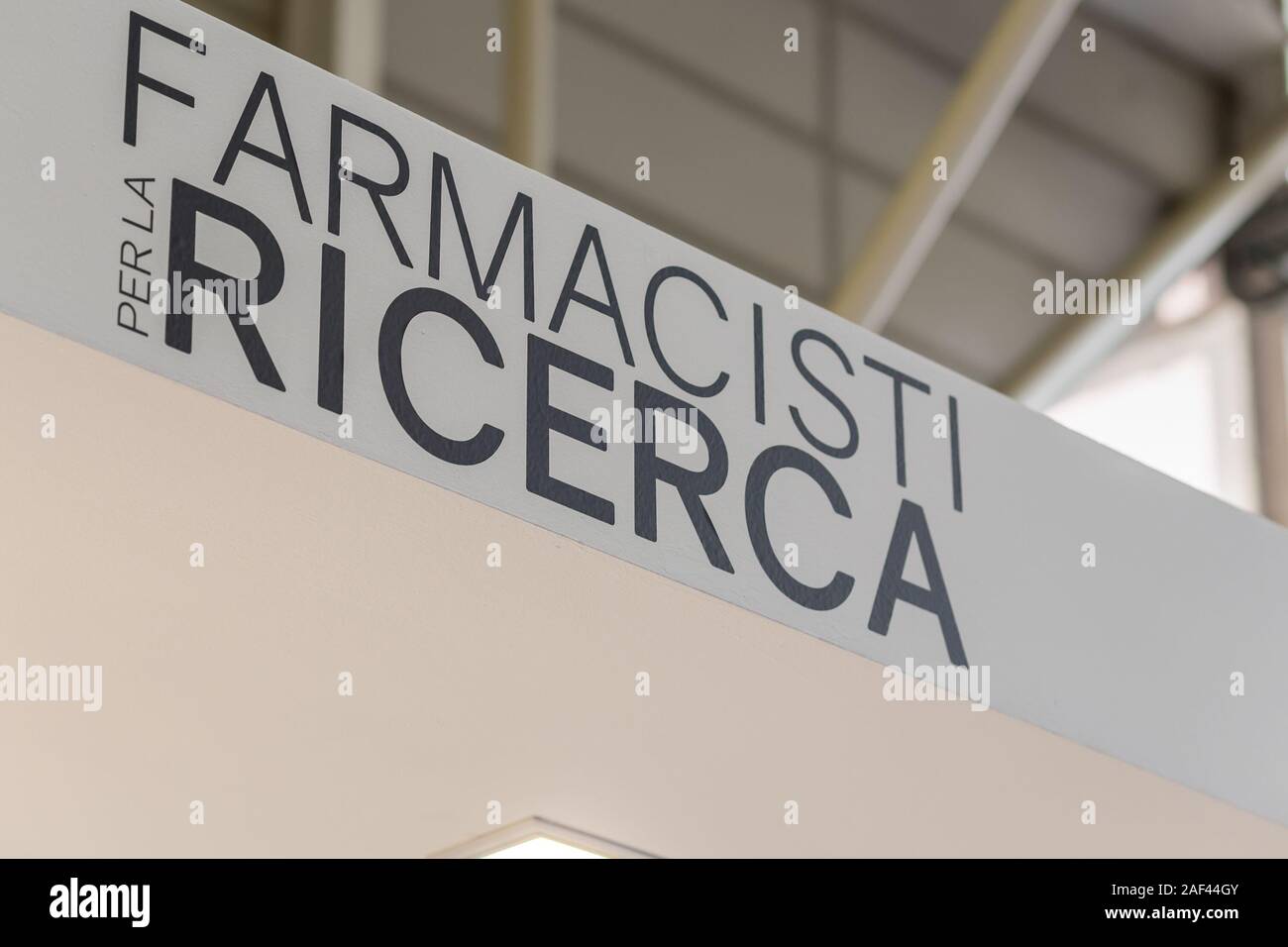 BOLOGNA (BO), ITALY - APRIL 12, 2019: light is enlightening FARMACISTI PER RICERCA logo in Cosmofarma Exhibition, the pharmacy world’s leading Europea Stock Photo