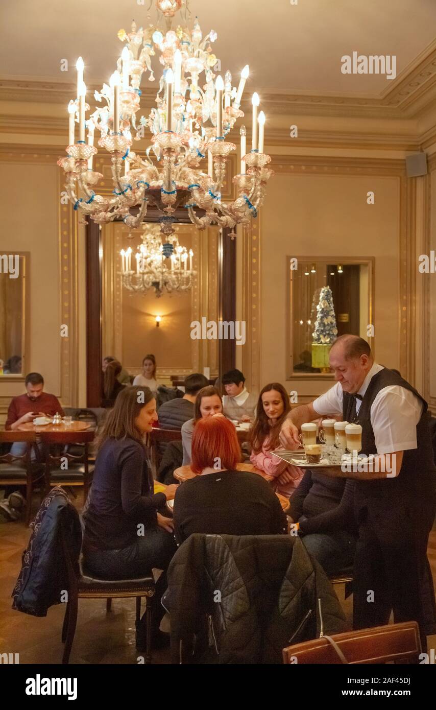 Vienna cafe; a waiter serving customers, The Demel coffee house interior, Vienna Austria Europe Stock Photo