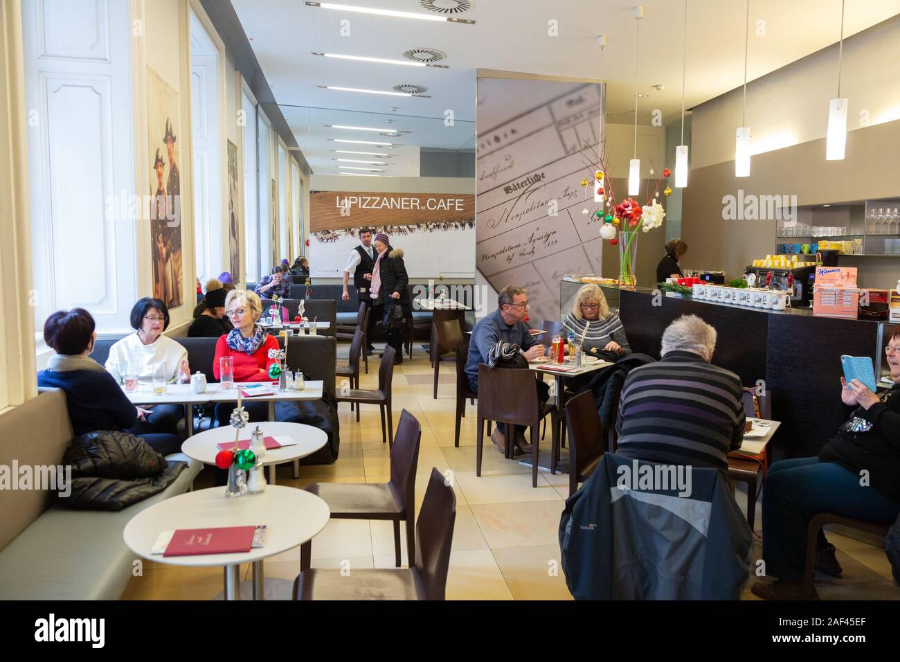 Lipizzaner Cafe Vienna; people sitting eating and drinking in the Lipizzaner cafe, Hofburg palace, Vienna Austria Europe Stock Photo